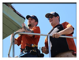 Craftsmen Anthony and Andrew repair box gutters in Cincinnati.