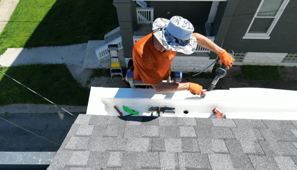 ProMaster craftsman heat welding the PVC liner to the PVC coated drip edge.