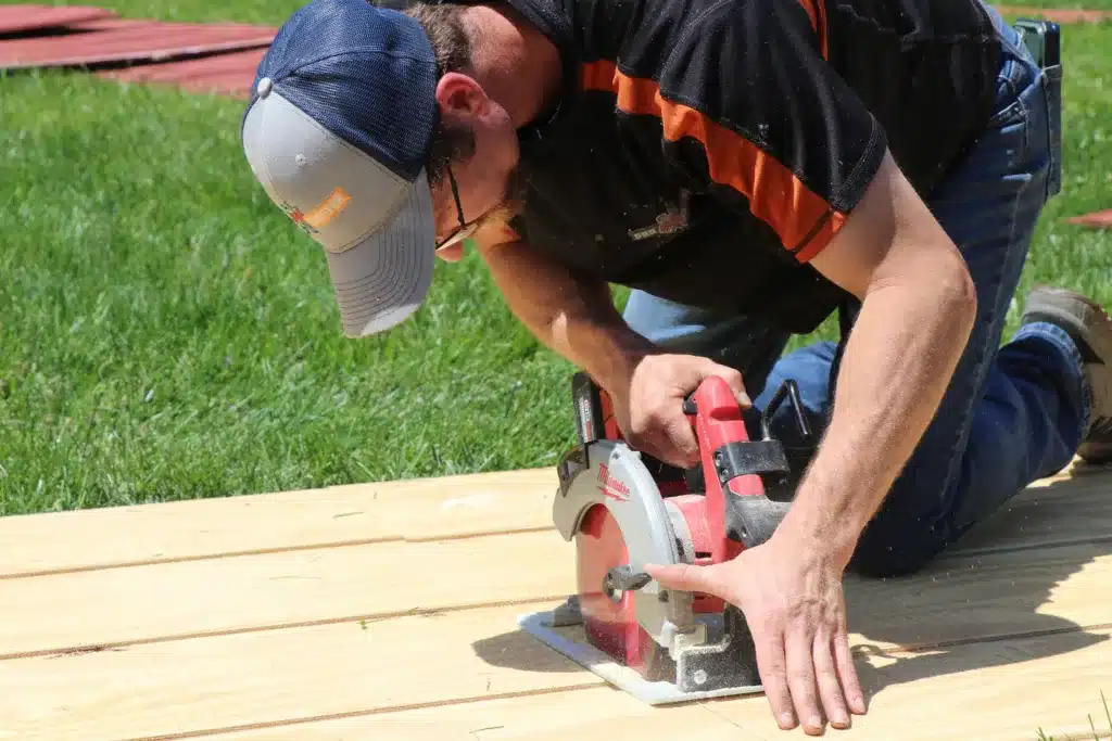 ProMaster Craftsman Chris Snook carefully cut the new wood siding to the correct size.