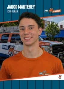 Portrait of a smiling young man in an orange Pro Master craftsman shirt, with brand graphics in the background.